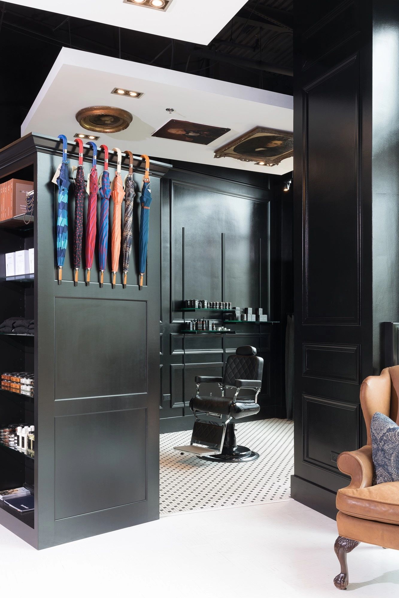 Elegant barbershop interior with umbrellas and vintage décor.